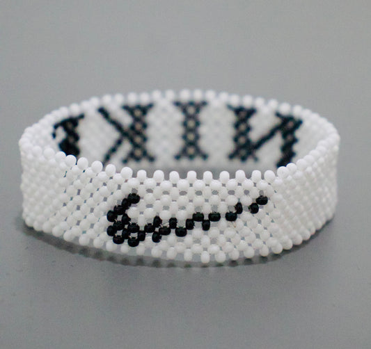 White nike logo and name beads bracelet.