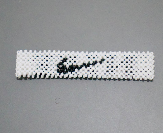 White nike logo and name beads bracelet.